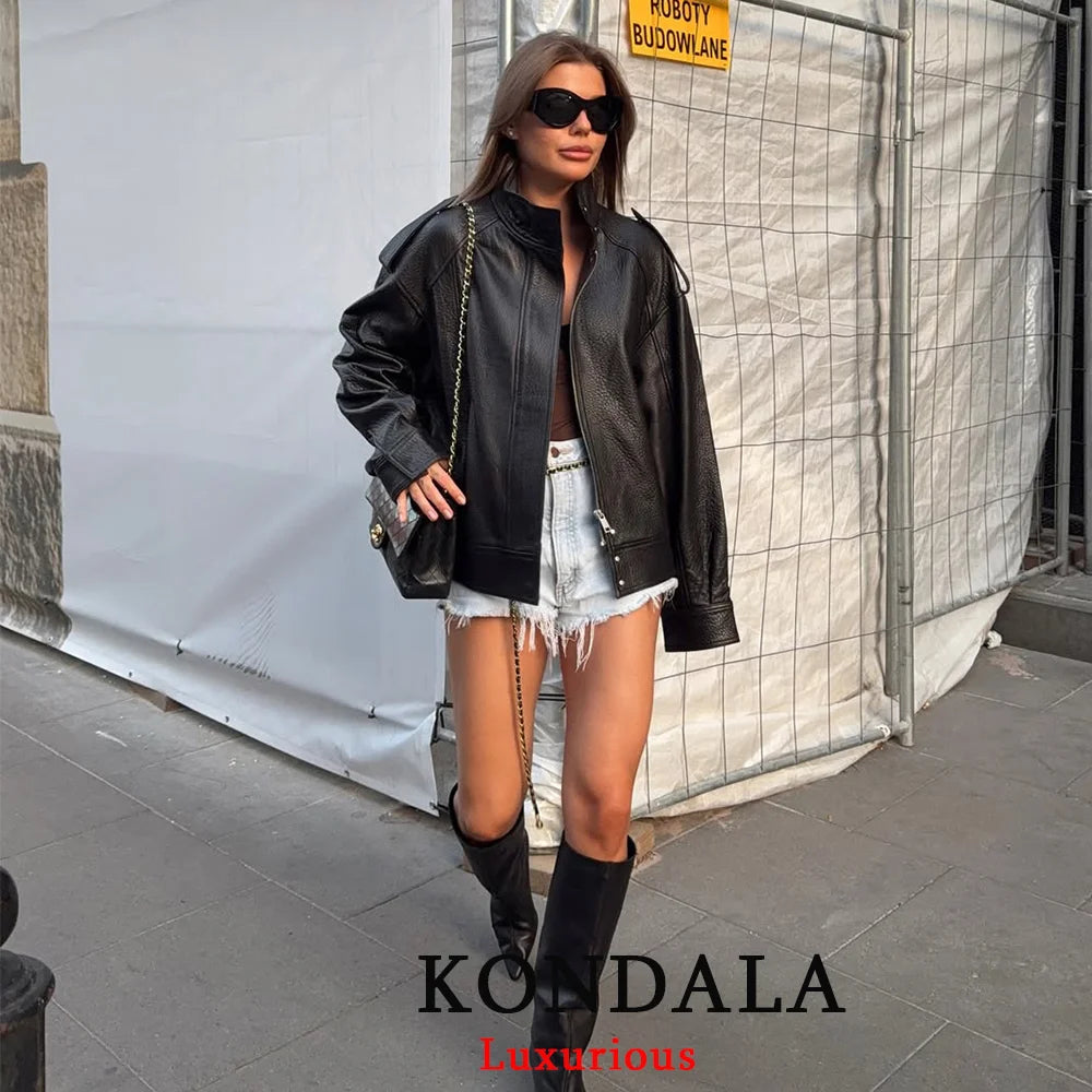 Veste noire chic en simili cuir pour femme, manches longues, fermeture à boutons, coupe oversize avec finition élastiquée, manteau tendance mode automne-hiver 2025,